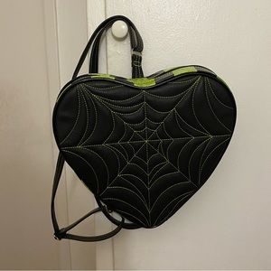 Love pain and stitches black and green heart web backpack